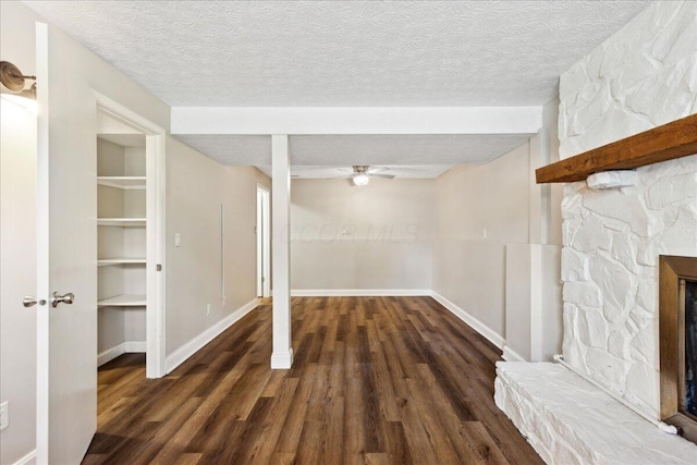 4096 Jonquil St, Columbus, OH 43224 - below grade area with a textured ceiling, ceiling fan, wood finished floors, and a fireplace