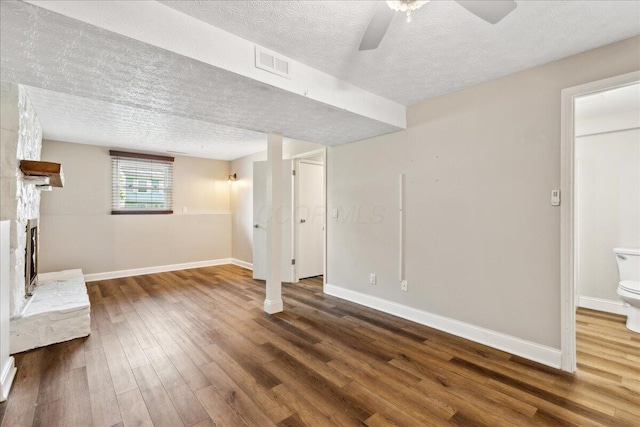 4096 Jonquil St, Columbus, OH 43224 - basement featuring visible vents, wood finished floors, baseboards, a textured ceiling, and a ceiling fan