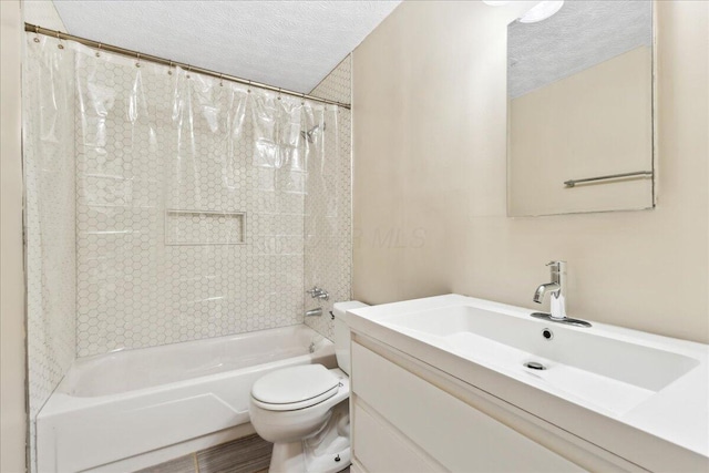 4096 Jonquil St, Columbus, OH 43224 - full bathroom with shower / tub combo, a textured ceiling, toilet, and vanity