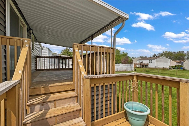 4096 Jonquil St, Columbus, OH 43224 - wooden deck with a lawn and fence