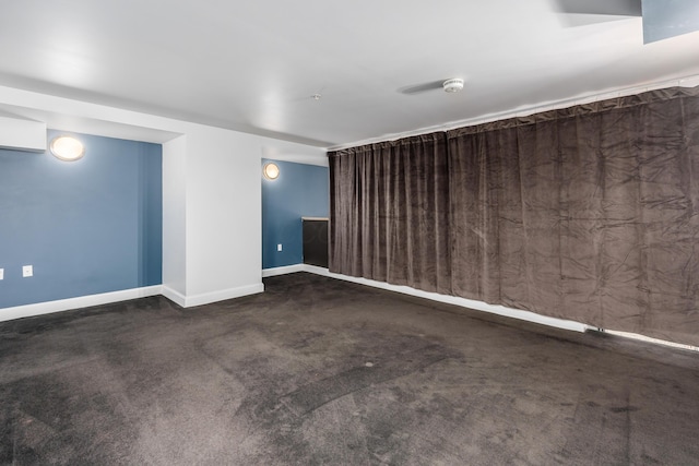 carpeted spare room with baseboards