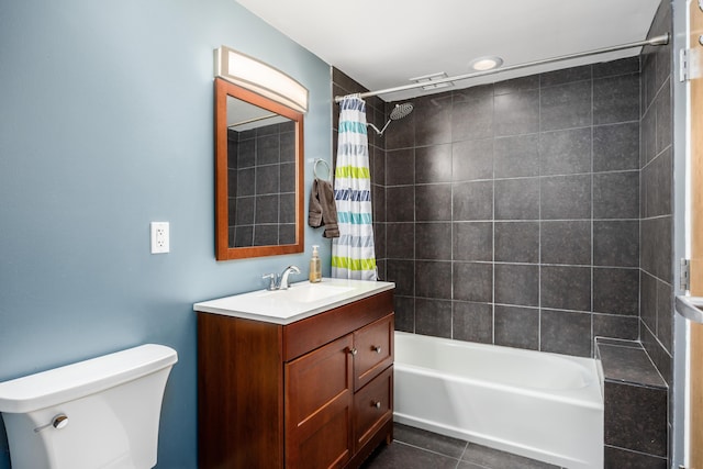 bathroom featuring toilet, tile patterned flooring, shower / bath combo, and vanity