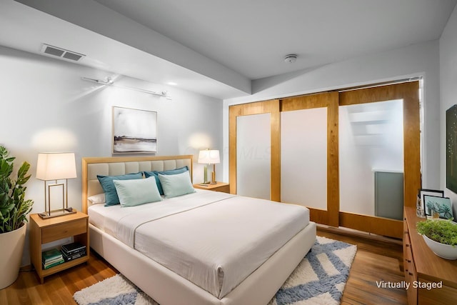 106 N High St Unit 104, Columbus, OH 43215 - bedroom featuring visible vents and wood finished floors