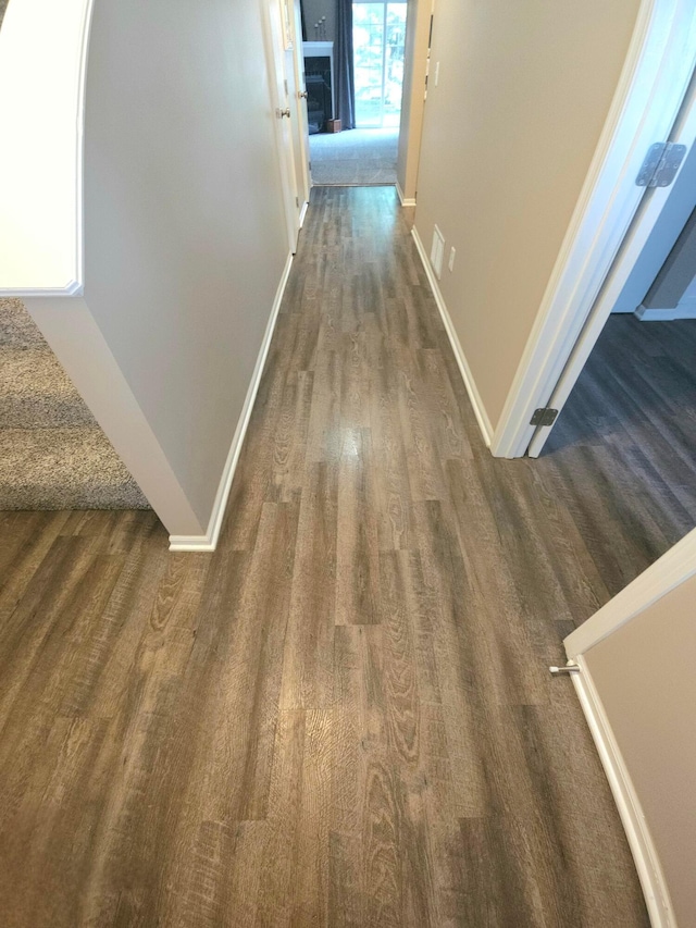 6682 Lagrange Dr Unit 48B, Canal Winchester, OH 43110 - corridor featuring baseboards and dark wood-type flooring