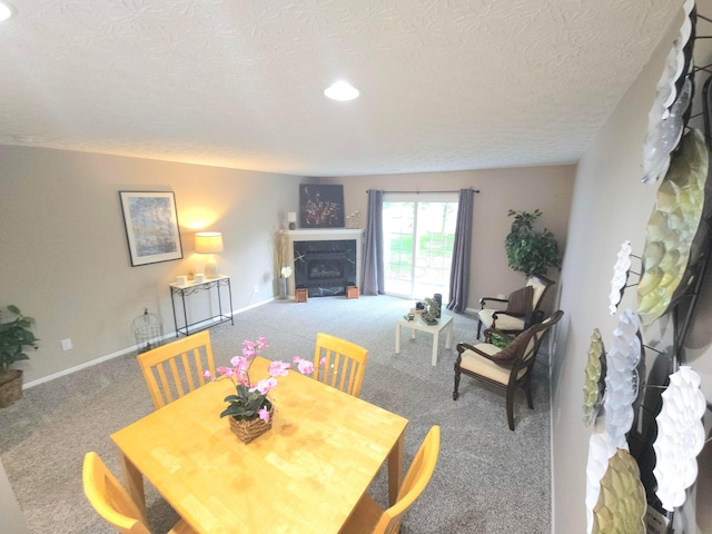 6682 Lagrange Dr Unit 48B, Canal Winchester, OH 43110 - carpeted dining room featuring baseboards, a fireplace, recessed lighting, and a textured ceiling
