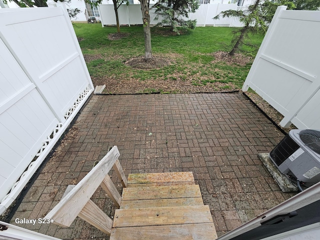 6682 Lagrange Dr Unit 48B, Canal Winchester, OH 43110 - view of patio / terrace featuring central air condition unit and fence