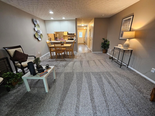 6682 Lagrange Dr Unit 48B, Canal Winchester, OH 43110 - dining area featuring baseboards, a textured ceiling, and light carpet