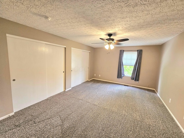 6682 Lagrange Dr Unit 48B, Canal Winchester, OH 43110 - unfurnished bedroom featuring carpet floors, ceiling fan, and two closets