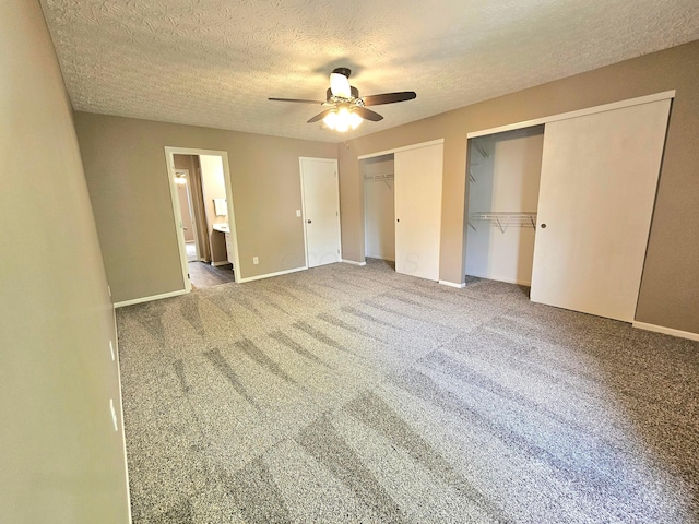 6682 Lagrange Dr Unit 48B, Canal Winchester, OH 43110 - unfurnished bedroom with carpet floors, a textured ceiling, multiple closets, baseboards, and ensuite bathroom