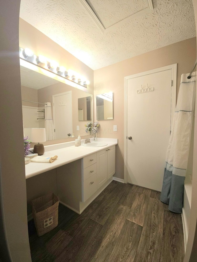 6682 Lagrange Dr Unit 48B, Canal Winchester, OH 43110 - bathroom with a textured ceiling, curtained shower, vanity, and wood finished floors