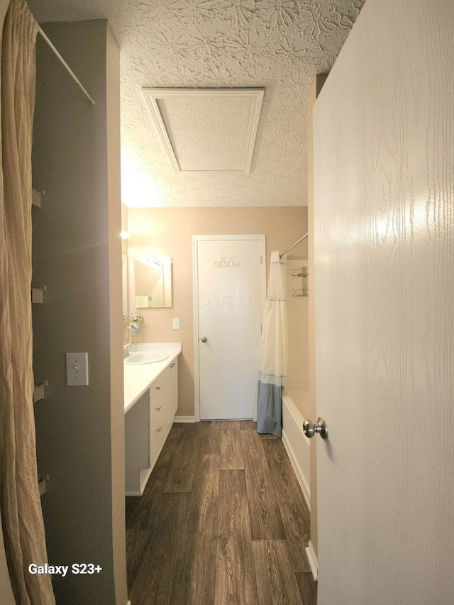 6682 Lagrange Dr Unit 48B, Canal Winchester, OH 43110 - full bath with vanity, a textured ceiling, wood finished floors, and shower / tub combo with curtain