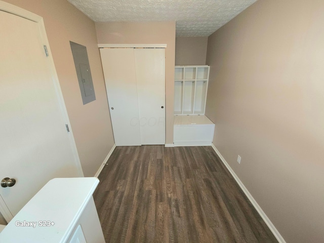 6682 Lagrange Dr Unit 48B, Canal Winchester, OH 43110 - hallway featuring a textured ceiling, baseboards, electric panel, and wood finished floors