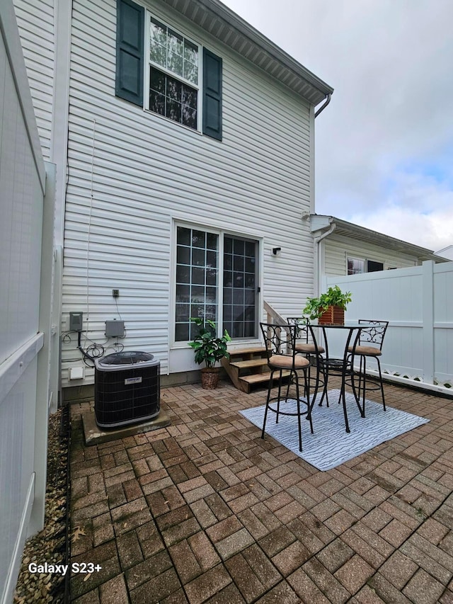 6682 Lagrange Dr Unit 48B, Canal Winchester, OH 43110 - view of patio featuring central air condition unit, fence, and entry steps