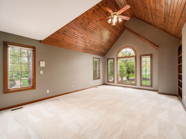 unfurnished room featuring visible vents, baseboards, and light colored carpet