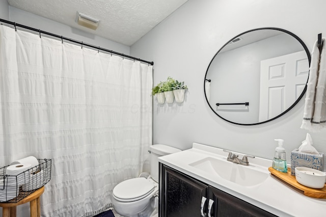 full bathroom with a textured ceiling, visible vents, toilet, and vanity