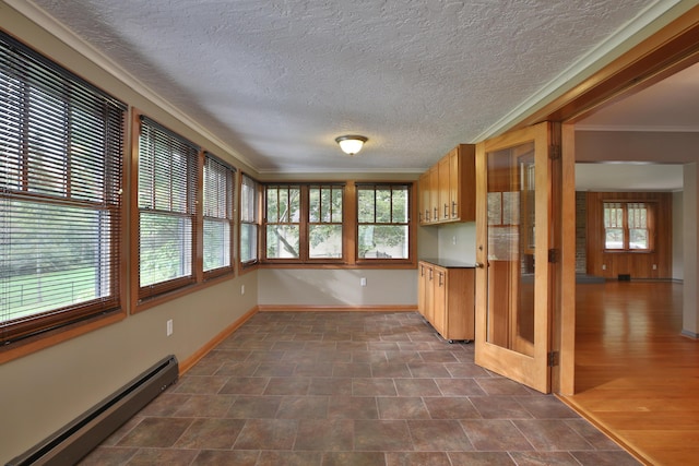 2589 Brookwood Rd, Columbus, OH 43209 - unfurnished sunroom featuring a baseboard radiator, ornamental molding, baseboards, and a textured ceiling