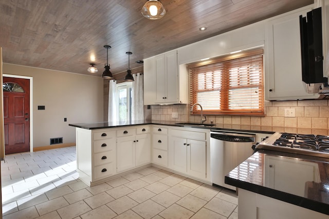 2589 Brookwood Rd, Columbus, OH 43209 - kitchen featuring stainless steel dishwasher, a sink, dark countertops, a peninsula, and tasteful backsplash