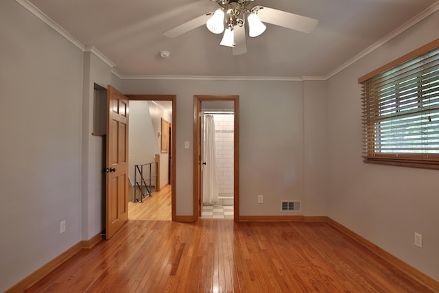 2589 Brookwood Rd, Columbus, OH 43209 - unfurnished bedroom featuring light wood finished floors, ornamental molding, baseboards, connected bathroom, and ceiling fan