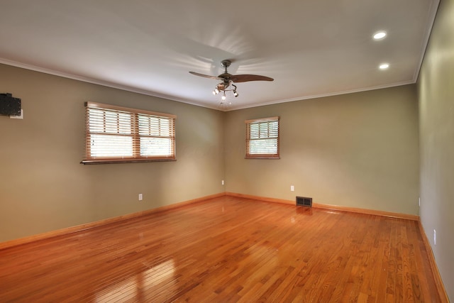 2589 Brookwood Rd, Columbus, OH 43209 - empty room with a ceiling fan, ornamental molding, light wood finished floors, baseboards, and recessed lighting