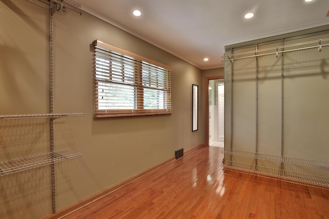 2589 Brookwood Rd, Columbus, OH 43209 - unfurnished bedroom with recessed lighting, light wood-style flooring, crown molding, and baseboards