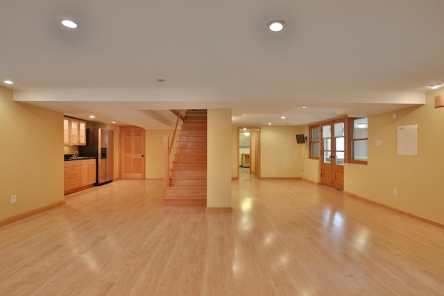 2589 Brookwood Rd, Columbus, OH 43209 - unfurnished living room with baseboards, stairway, light wood-style floors, and recessed lighting