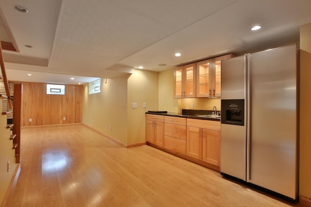 2589 Brookwood Rd, Columbus, OH 43209 - kitchen with stainless steel refrigerator with ice dispenser, a sink, dark countertops, light wood finished floors, and glass insert cabinets
