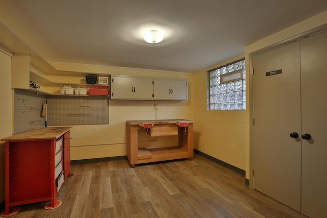 2589 Brookwood Rd, Columbus, OH 43209 - entrance foyer with light wood-type flooring and concrete block wall