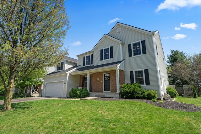 traditional-style home featuring a porch, brick siding, fence, a front lawn, and concrete driveway