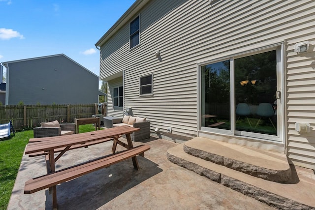 view of patio / terrace featuring fence, outdoor dining space, and entry steps