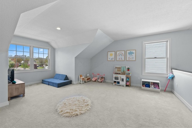 playroom featuring baseboards, carpet flooring, and lofted ceiling