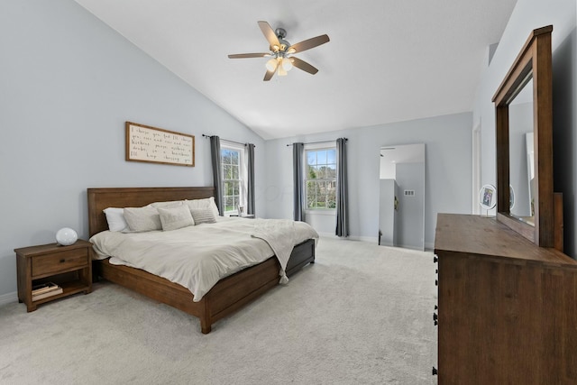 bedroom featuring a ceiling fan, baseboards, light colored carpet, and vaulted ceiling