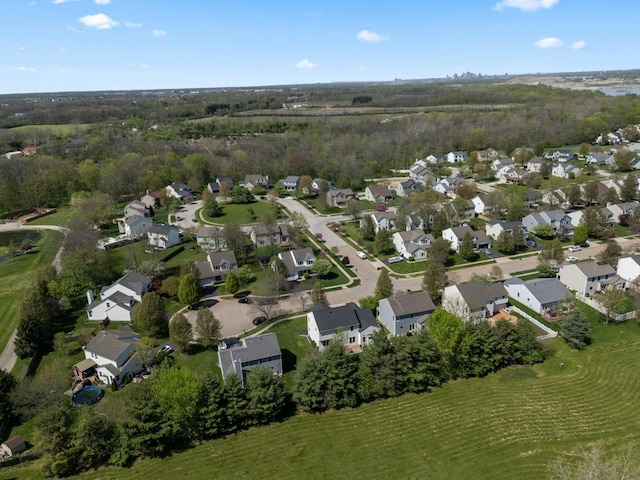 birds eye view of property with a residential view