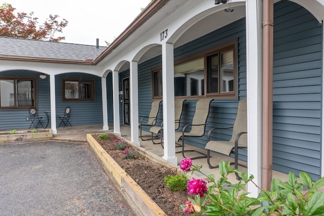 173 S Chesterfield Rd, Columbus, OH 43209 - view of exterior entry with a porch and roof with shingles