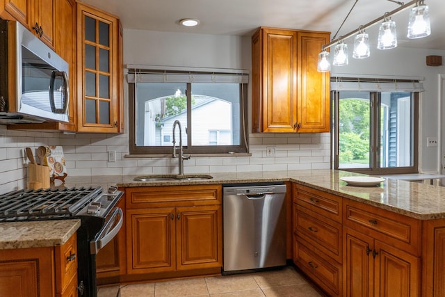 173 S Chesterfield Rd, Columbus, OH 43209 - kitchen with stainless steel appliances, a sink, and brown cabinetry