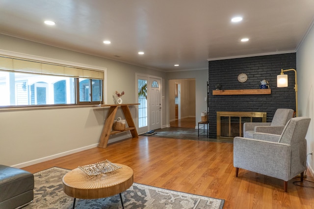 173 S Chesterfield Rd, Columbus, OH 43209 - living area featuring baseboards, crown molding, wood finished floors, a brick fireplace, and recessed lighting