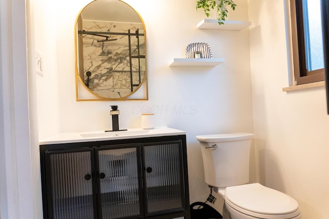 173 S Chesterfield Rd, Columbus, OH 43209 - bathroom with toilet, vanity, and a shower