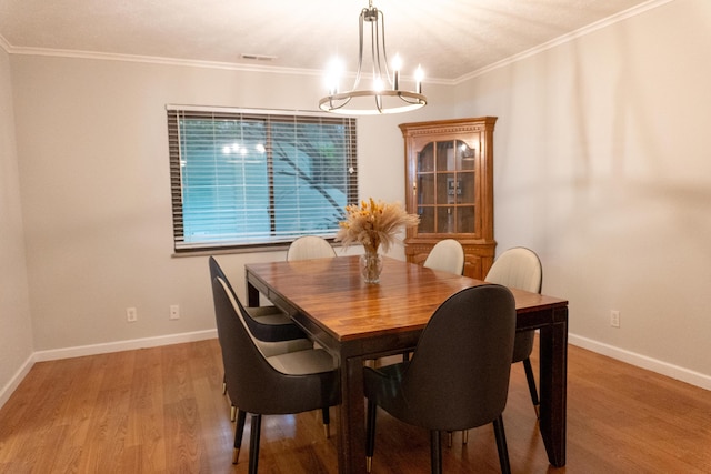 173 S Chesterfield Rd, Columbus, OH 43209 - dining area featuring light wood-type flooring, a chandelier, baseboards, and ornamental molding