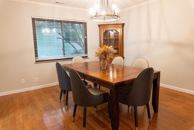 173 S Chesterfield Rd, Columbus, OH 43209 - dining room with a chandelier, baseboards, light wood-type flooring, and crown molding