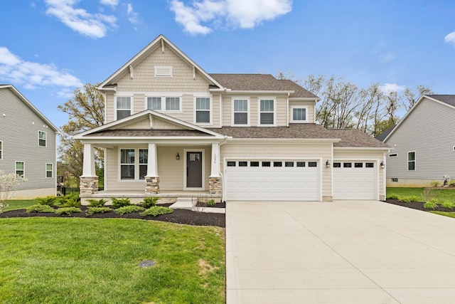 1206 Clover St, Sunbury, OH 43074 - craftsman inspired home with a garage, a front yard, a shingled roof, concrete driveway, and a porch