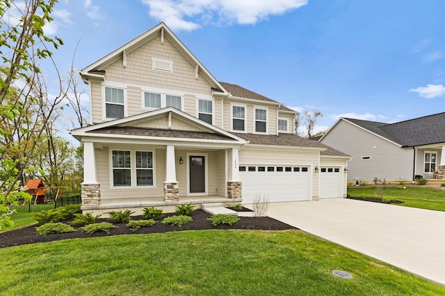 1206 Clover St, Sunbury, OH 43074 - craftsman-style house featuring fence, a front lawn, stone siding, a porch, and driveway