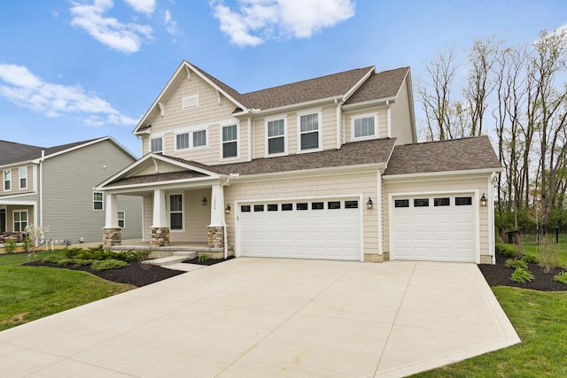 1206 Clover St, Sunbury, OH 43074 - craftsman-style house with covered porch, a shingled roof, concrete driveway, and a front yard