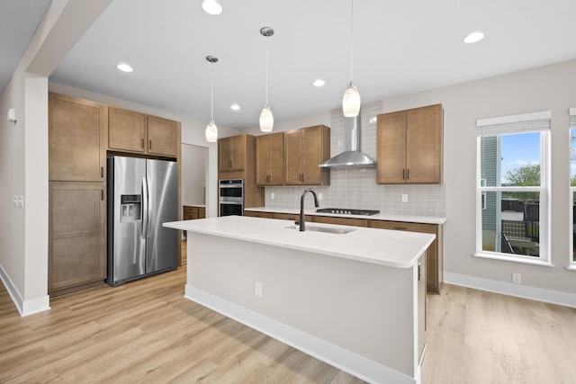 1206 Clover St, Sunbury, OH 43074 - kitchen featuring light countertops, wall chimney exhaust hood, a sink, appliances with stainless steel finishes, and backsplash