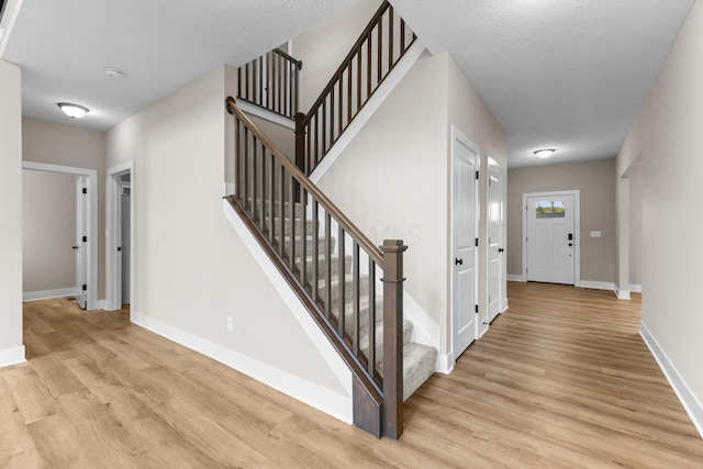 1206 Clover St, Sunbury, OH 43074 - stairs featuring baseboards and wood finished floors