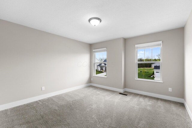 1206 Clover St, Sunbury, OH 43074 - carpeted spare room with baseboards and visible vents