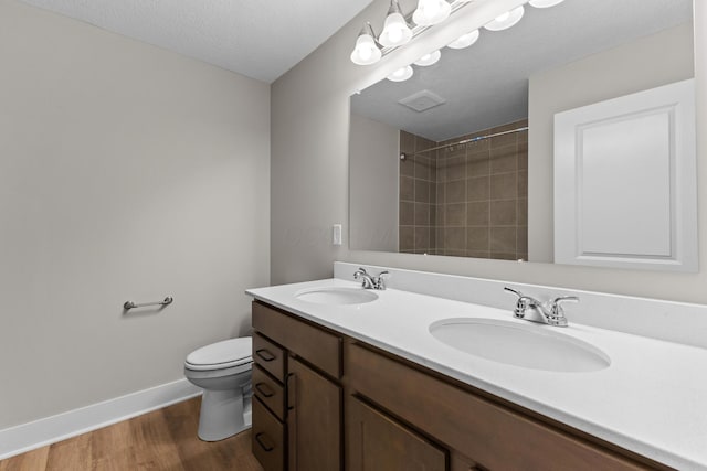 1206 Clover St, Sunbury, OH 43074 - full bath featuring toilet, baseboards, a sink, and wood finished floors