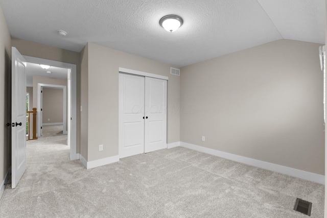 1206 Clover St, Sunbury, OH 43074 - unfurnished bedroom featuring light colored carpet, baseboards, visible vents, and a closet