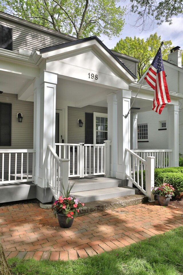 property entrance with covered porch