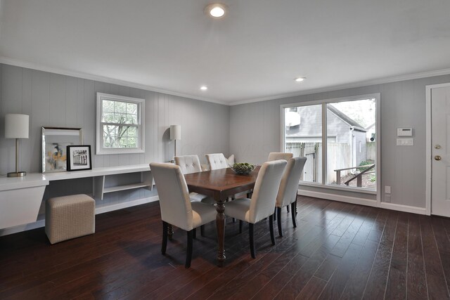 dining area with crown molding, dark wood-type flooring, baseboards, and recessed lighting