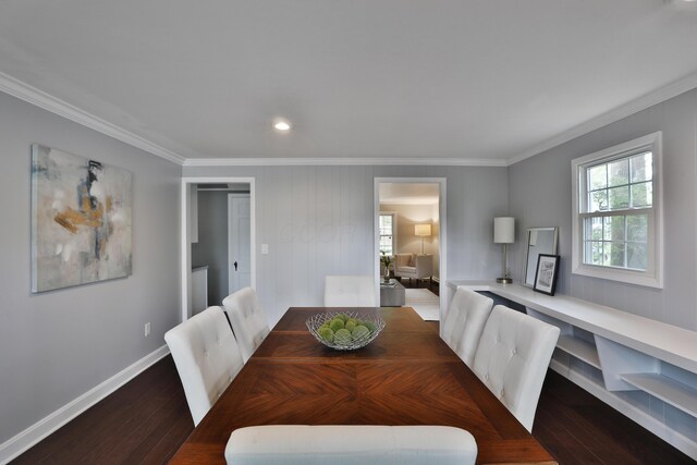 dining room featuring ornamental molding, wood finished floors, baseboards, and recessed lighting