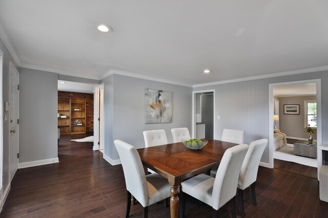 dining area with hardwood / wood-style flooring, baseboards, crown molding, and recessed lighting